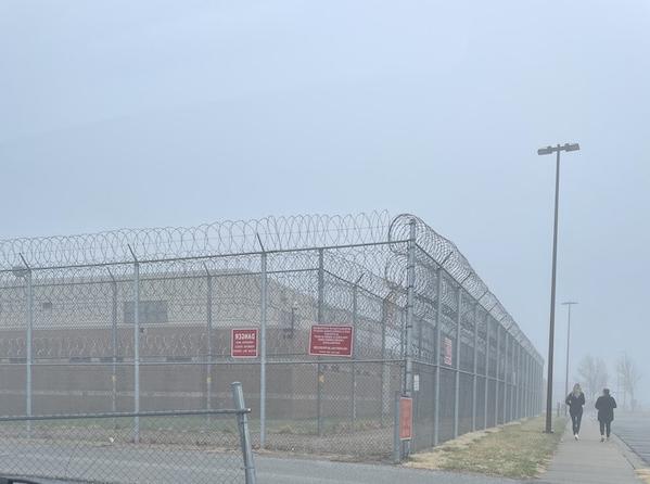 Exterior of a youth correctional facility on a rainy, misty morning. 